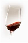 Red wine swirling in glass