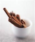 Several cinnamon sticks in a small pot