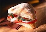 Tomatoes, mozzarella and rocket in ciabatta