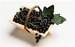 Blackcurrants in a wooden basket