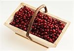 Fresh cranberries in a wooden basket