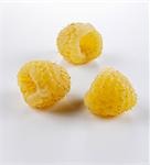 Three yellow raspberries