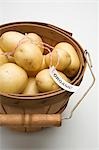 Organic potatoes in woodchip basket