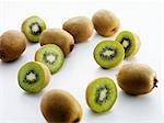 Whole and halved kiwi fruit