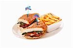 Steak sandwich with dish of chips