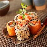 Lobster Sushi Rolls on a Plate; Chopsticks