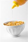 Putting honey on cornflakes