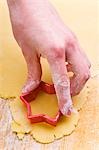 Cutting out a biscuit with a star-shaped cutter