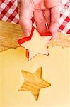 Cutting biscuits out of biscuit dough