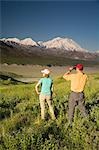 Young couple of visitors view MtMcKinley near the Eielson visitor center MtMcKinley Denali NP Alaska