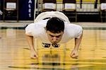 Boy doing Seal Hop Jump 2006 Senior Native Youth Olympic Games Alaska Anchorage Sullivan Arena