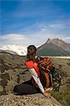 Woman looking out across the Root Glacier moraine near Kennicott in Wrangell-St.Elias National Park, Alaska