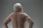 Naked senior man, rear view