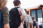 High school students queuing for school bus