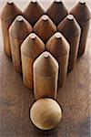 Close-up of Wooden Bowling Pins and Ball