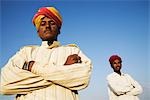 Portrait of two young men standing with their arms crossed, Jaisalmer, Rajasthan, India