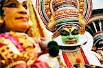 Three people kathakali dancing