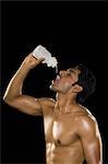 Man drinking water from a water bottle