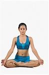 Close-up of a young woman practicing yoga