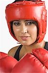 Portrait of a young woman boxing