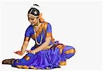 Woman performing Sarpa Sirsa of Bharatnatyam