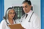 Female doctor discussing with a doctor, Gurgaon, Haryana, India