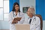 Two doctors discussing a report, Gurgaon, Haryana, India