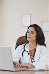 Female doctor using a laptop, Gurgaon, Haryana, India