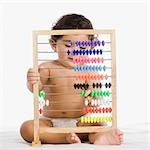 Baby boy playing with an abacus