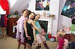 Young Girls striking a pose in trendy bedroom at Slumber Party