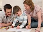 Parents on Floor Coloring With Son