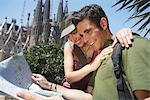 Young Couple Reading City Map