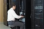 Technician working in server room