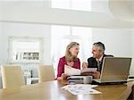 Woman sitting at table with financial advisor