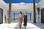 Beautiful women standing in modern villa