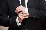 Close-up of Groom Adjusting Cuff Links