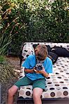 Teenage Boy Taking Pictures, Newport Beach, Orange County, USA