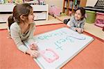 Little Girls Colouring in Bedroom