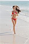 Woman Running on the Beach