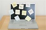 Adhesive notes on laptop