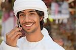 Middle Eastern man using mobile phone