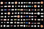 Rows of pills on black background