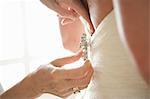 Afixing Brooch to Back of Wedding Gown