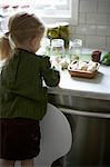 Young Girl Making Pickles