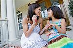 Mother Painting Daughter's Finger Nails