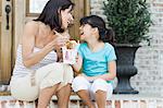 Mother and Daughter Eating Chinese Food