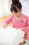 Japanese Girl Folding Laundry