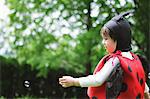 A Boy Wearing Costume Of Ladybird