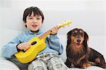 Miniature Dachshund And A Boy Relaxing