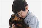 Miniature Dachshund And A Boy